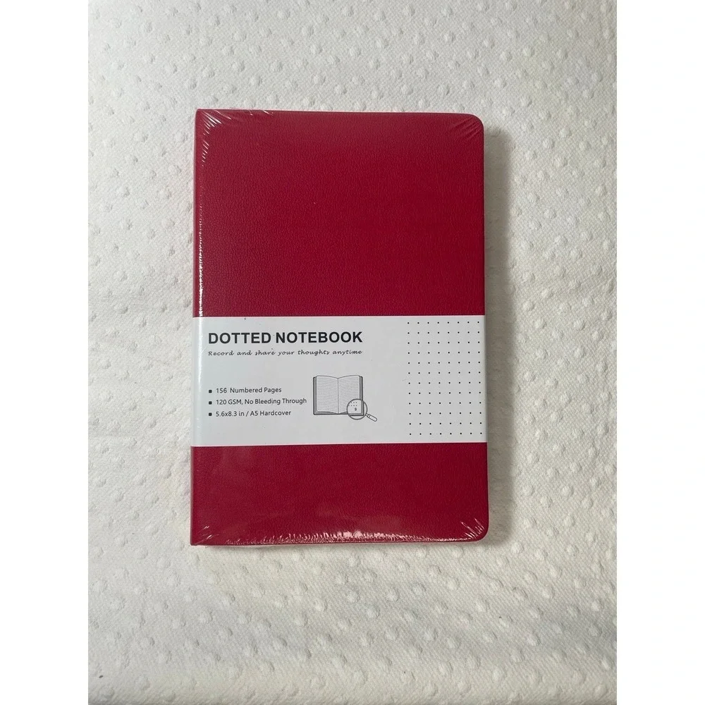 red A5-sized hardcover notebook featuring dotted pages NIP